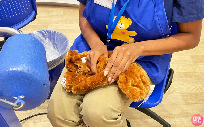 A Person Stuffing a Build a Bear Teddy Bear