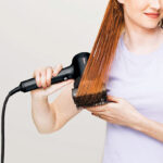 A Person Using a Shark HyperAIR Blow Dryer