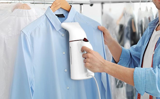 A Person Using the Kazazoo Handheld Steamer for Clothes