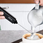 A Person Using the Venigo Handheld Milk Frother