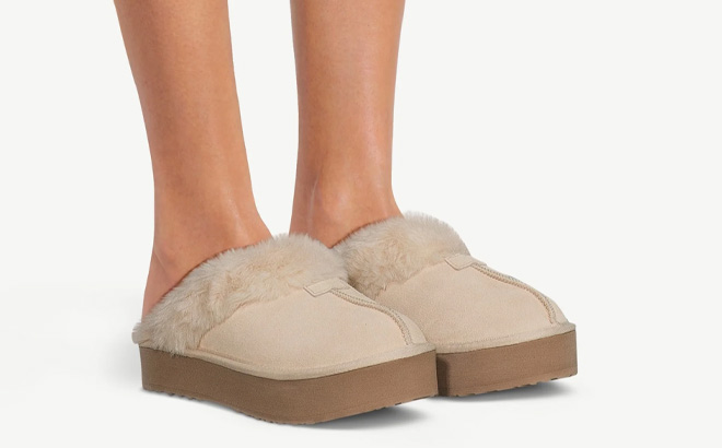 A Person Wearing Joyspun Womens Suede Platform Clog Slippers