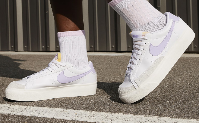 A Person Wearing Nike Blazer Low Platform Womens Shoes