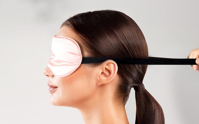 A Person Wearing the Silk Eye Mask for Sleeping