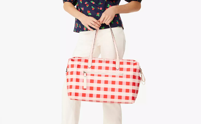 A Person holding a Kate Spade Chelsea Gingham Weekender Bag