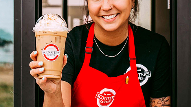 A Person holding a Scooters Coffee