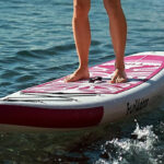 A Person standing on an Inflatable Paddle Board