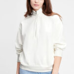 A Person wearing GAP Factory Half Zip Mockneck Sweatshirt in White Color