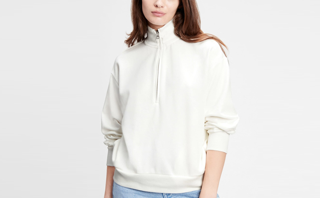 A Person wearing GAP Factory Half Zip Mockneck Sweatshirt in White Color