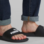 A Person wearing Puma Cool Cat Slides