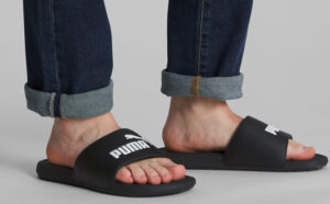 A Person wearing Puma Cool Cat Slides