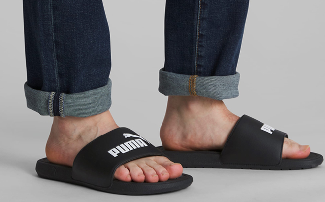 A Person wearing Puma Cool Cat Slides