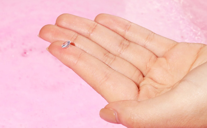 A Small Diamond Placed on a Fingertip