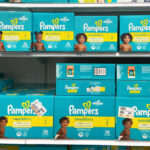 A Target shelf filled with Pampers Swaddlers Diapers