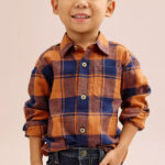 A Toddler Boy wearing a Jumping Beans Toddler Boys Flannel Shirt