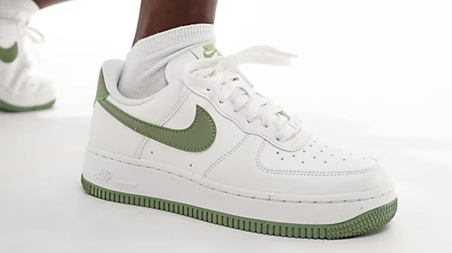 A Woman Wearing Nike Air Force 1 Shoes