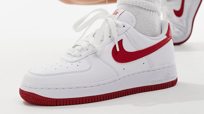 A Woman Wearing Nike Air Force 1 Sneakers in White and Red