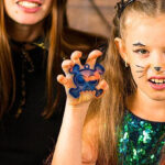 A girl holding a Halloween Pop Fidget Toy