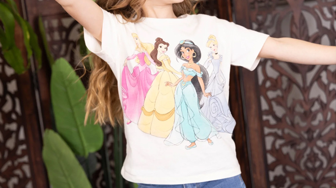 A girl wearing a Disney Character Character Toddler T Shirts