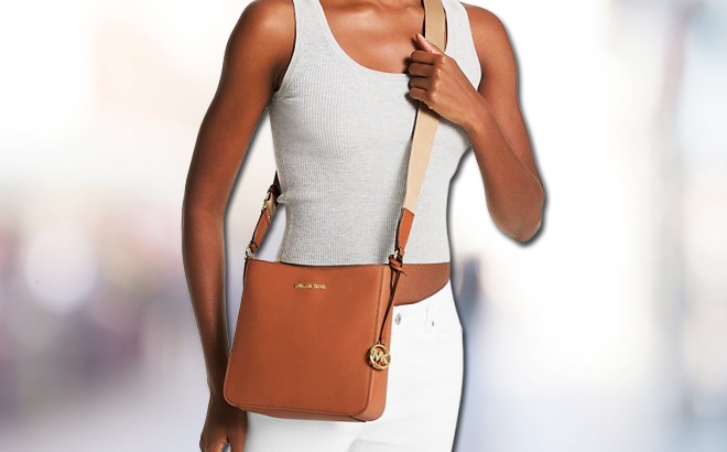 A lady with Michael Kors Jet Set Travel Small Messenger Bag