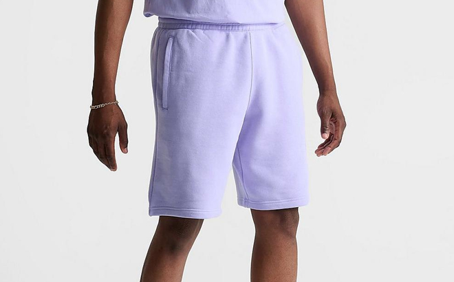 A Man Wearing Adidas Mens Shorts in Violet