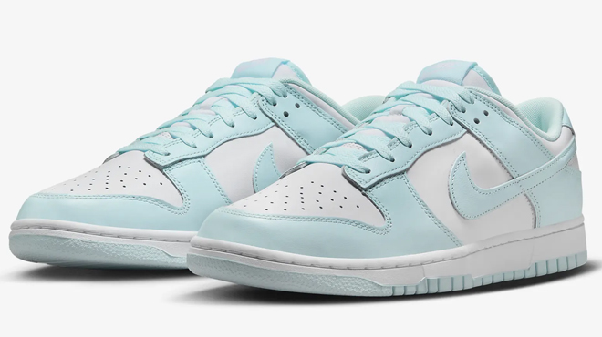 A pair of Nike Dunk Low Retro Mens Shoes in Glacier Blue color