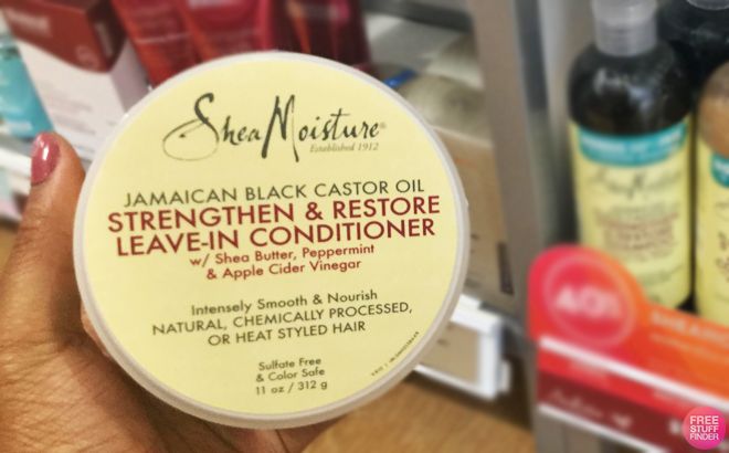 A person Holding SheaMoisture Castor Oil Leave In Conditioner