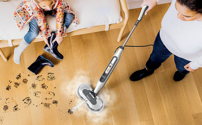 A person cleaning a floor using a Shark Steam Scrub Steam Mop