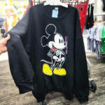 A person hoding a Mickey Mouse Womens Sweatshirt