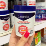 A person holding a Clearasil Salicylic Acid Acne Pads