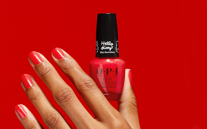 A person holding a OPI Hello Kitty 50th Anniversary Collection Nail Polish