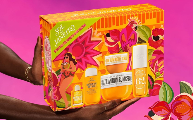 A person holding a box of Sol De Janeiro Hydration Celebration Body Routine Gift Set