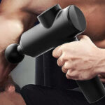 A person using a Bodi Well for a Better Life Massage Gun to massage his arm