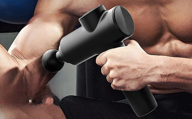 A person using a Bodi Well for a Better Life Massage Gun to massage his arm