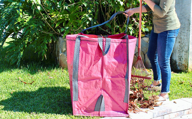 A person using a Improvements Heavy Duty Home Lawn Bag