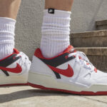 A person wearing a pair of Nike Full Force Low Mens Shoes