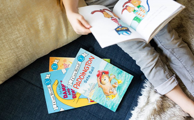 Books next to a Kid Reading a Book