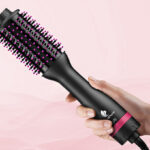 Hand Holding MiroPure Hair Dryer Brush