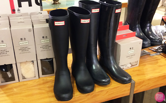 Hunter Womens Original Tall Boots in Black on a Shelf at a Store