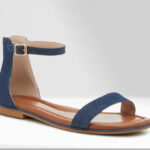 Kelly Katie Nymie Sandal in Navy Denim Color on the Table