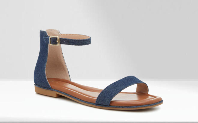 Kelly Katie Nymie Sandal in Navy Denim Color on the Table