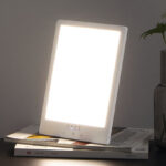 Merkury Innovations Light Therapy Lamp on a Nightstand