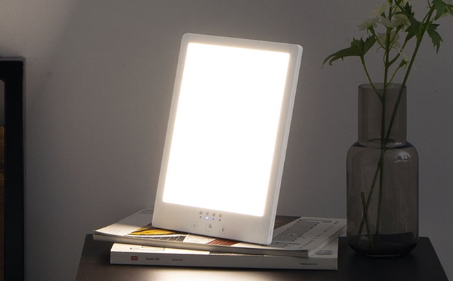 Merkury Innovations Light Therapy Lamp on a Nightstand