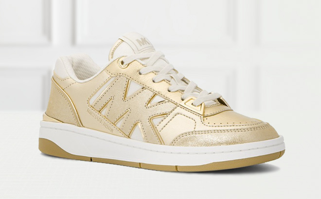 Michael Kors Rebel Metallic Leather Sneaker on the Table