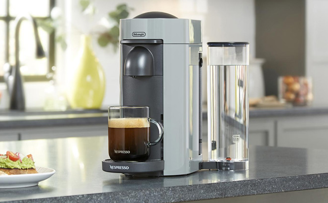 Nespresso Vertuo Plus Coffee and Espresso Maker by DeLonghi on the Table