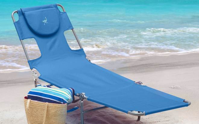 Ostrich Folding Chaise Lounge in Blue Color on a Beach