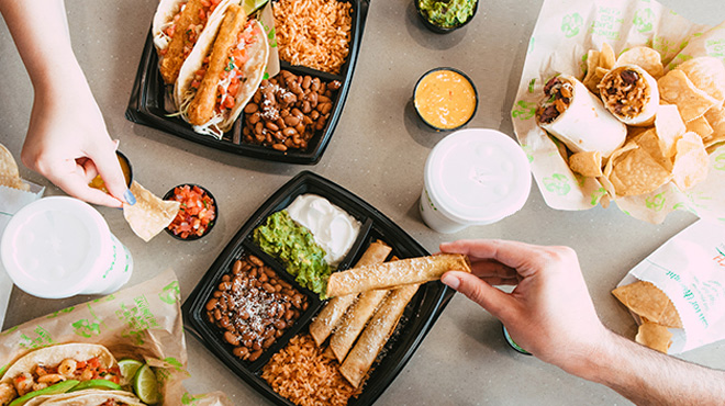 People Enjoying Various Dishes from Baja Fresh