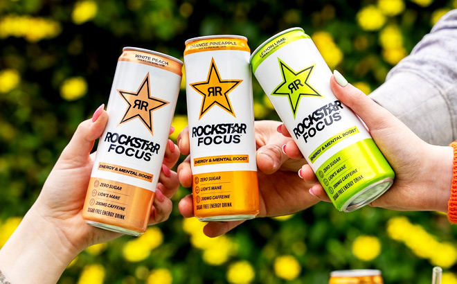 People Holding Rockstar Energy Drink Cans