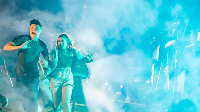 People running through Fog at Howl O Scream Event