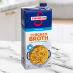 Swanson 100 Natural Unsalted Chicken Broth 32 oz Carton on the Kitchen Counter