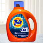 Tide Ultra Oxi Liquid Laundry Detergent 115 Ounce Bottle on a Table